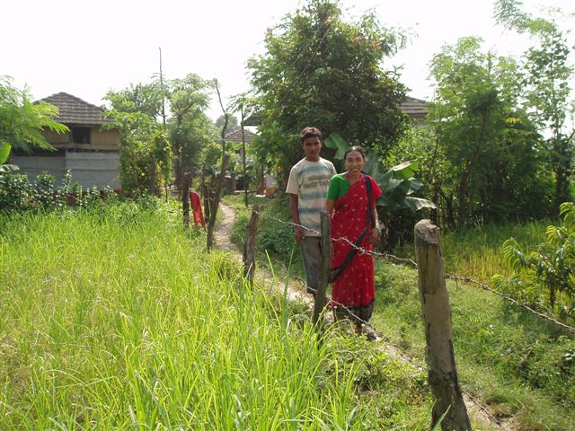 e1_urmila___her_son_in_their_village.jpg